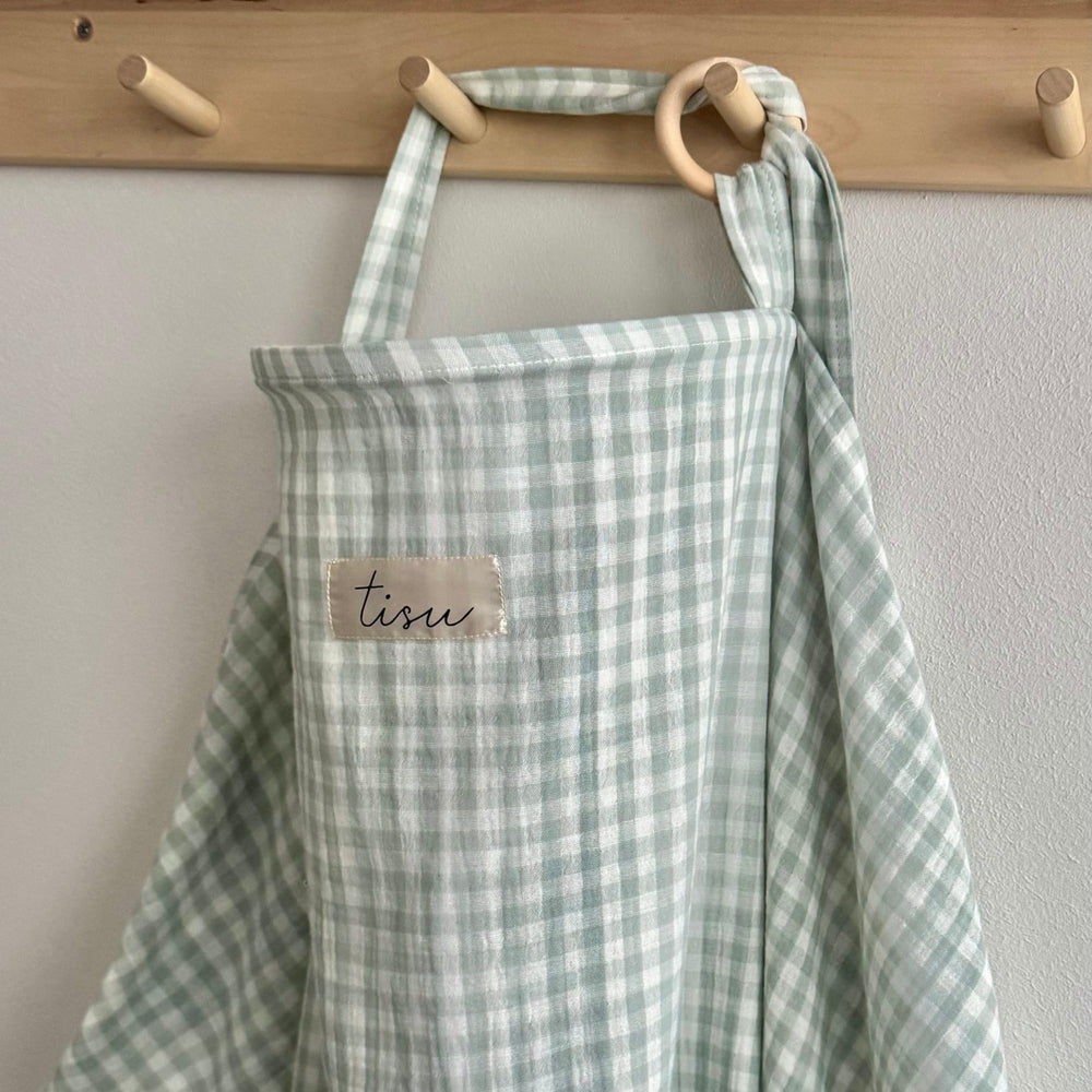 TISU nursing cover enables discreet breastfeeding with arch neckline and airflow.