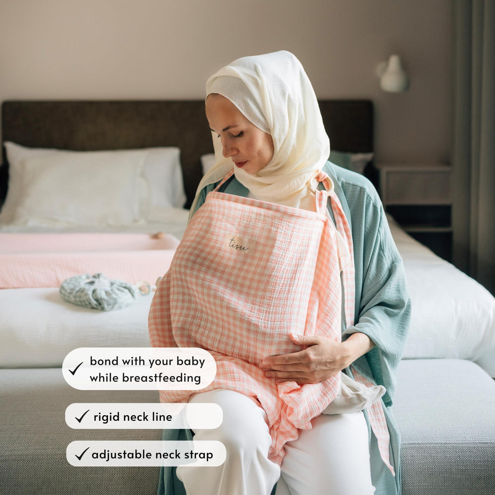 TISU nursing cover with arched neckline and adjustable strap for eye contact.