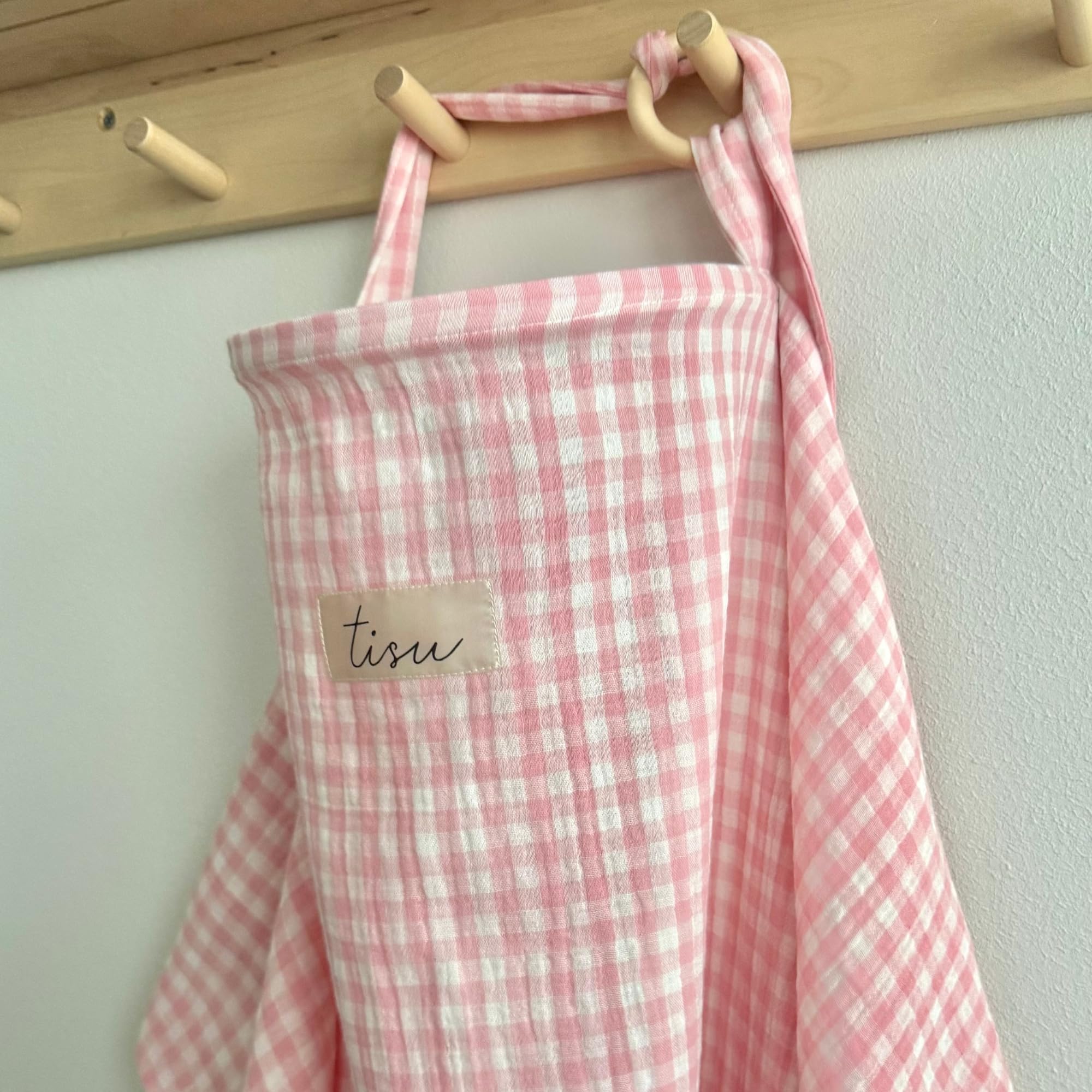 TISU nursing cover in pink gingham for discreet feeding on the go.