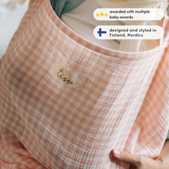 TISU nursing cover provides privacy while feeding in public settings.