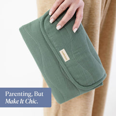 Toddlekind Mini Maven travel-ready mat shown attached to a stroller or bag.