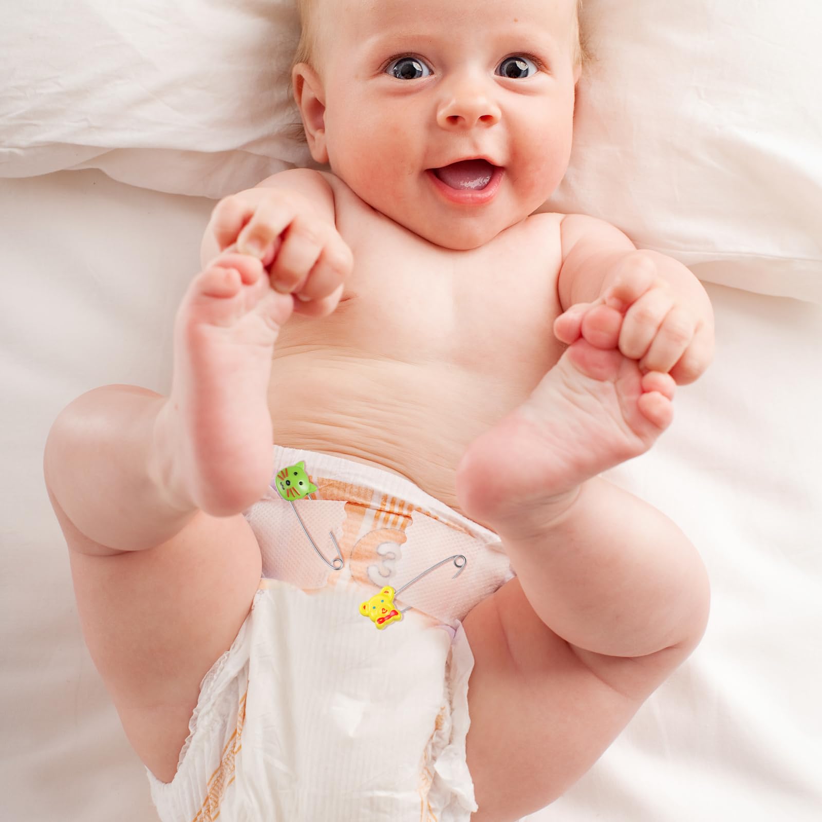 Toddmomy pins in use securing a cloth diaper and swaddle.