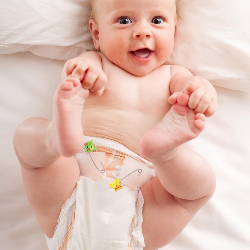 Toddmomy pins in use securing a cloth diaper and swaddle.