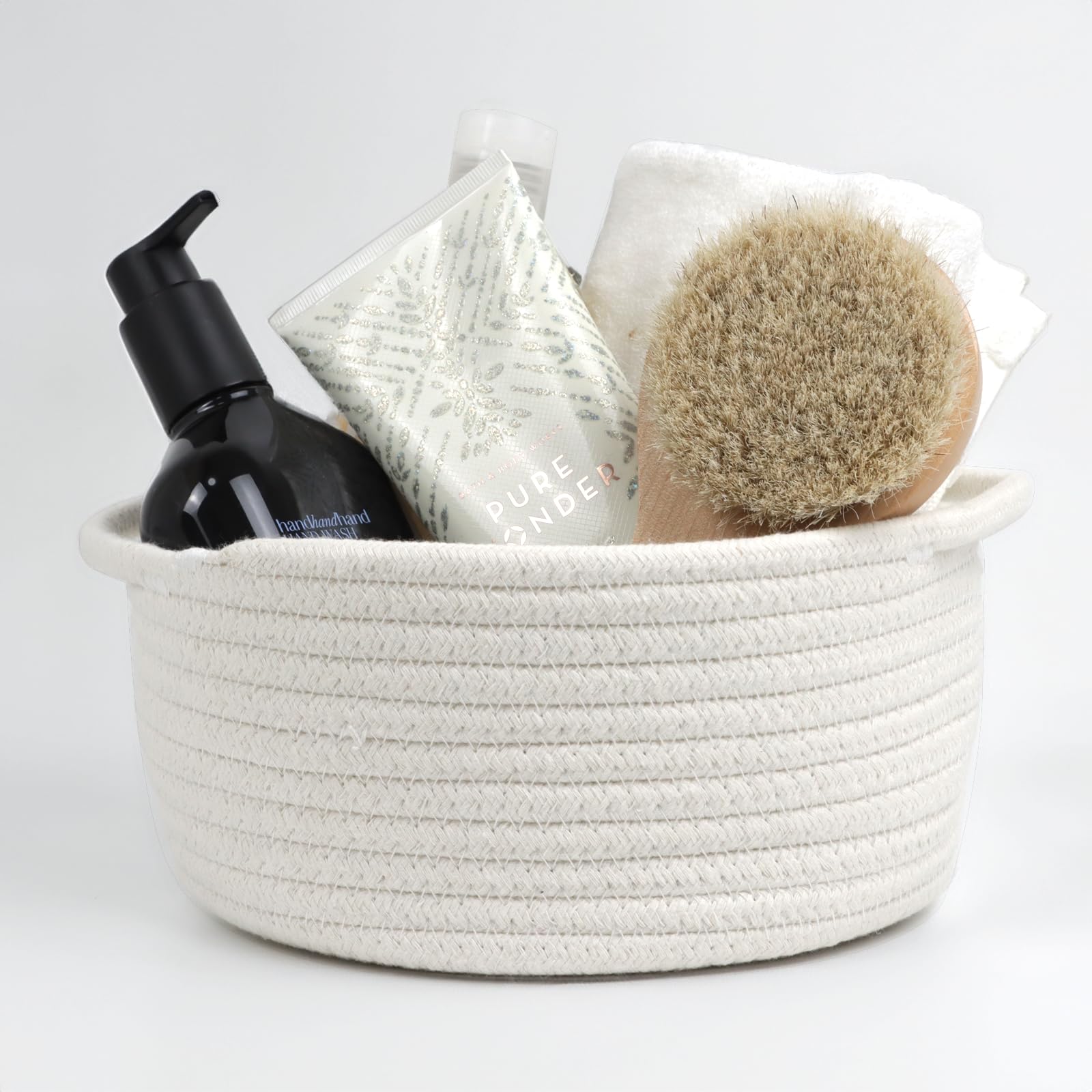 Togous cotton rope basket in living room adds decorative storage.