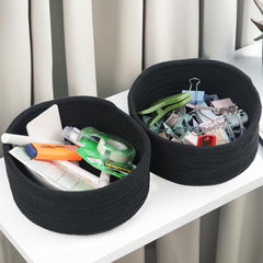Close-up of Togous woven black cotton rope basket texture.