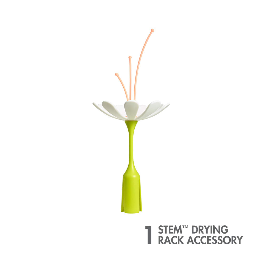 TOMY Boon Stem holds baby bottles for organized drying after washing.