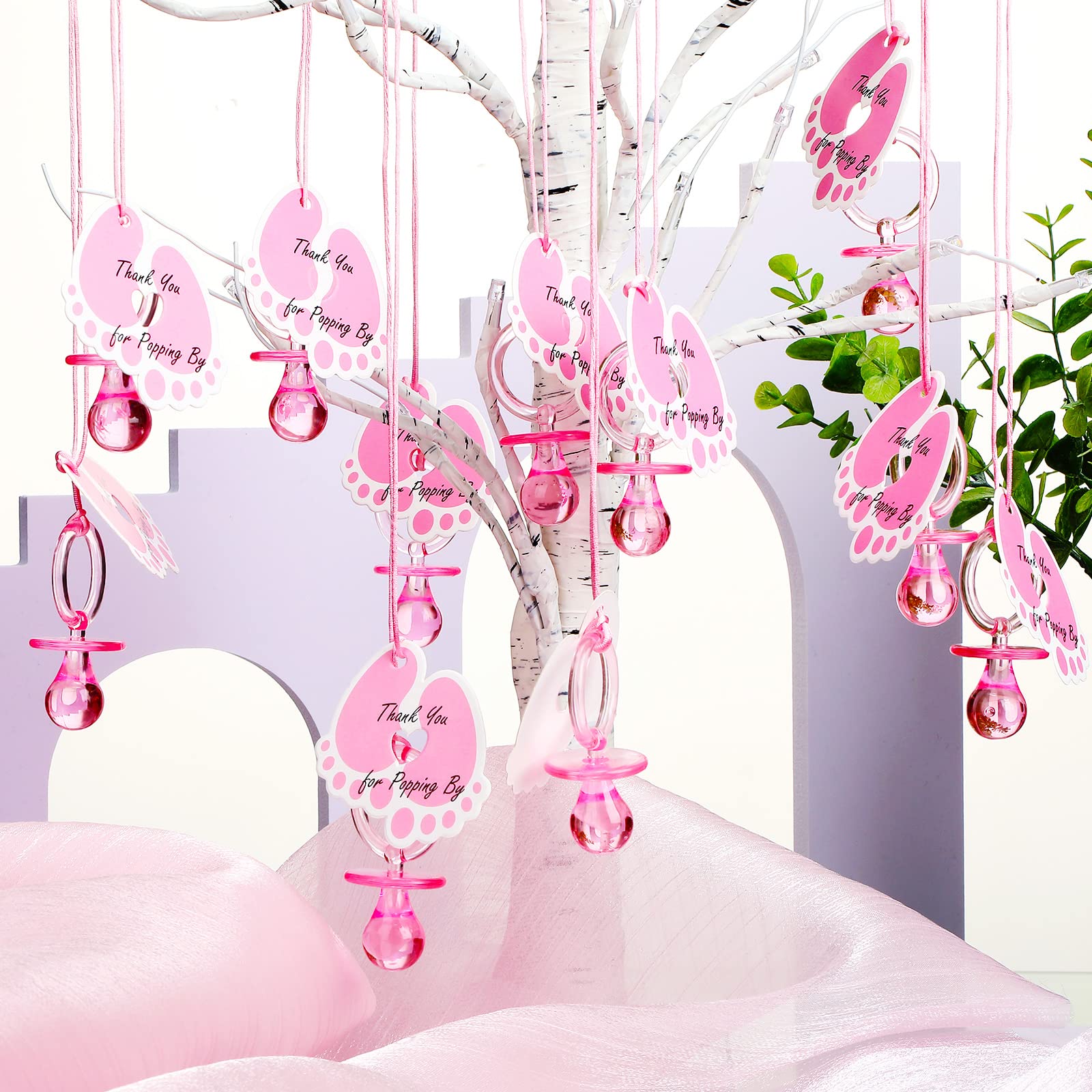 Tondiamo pacifier necklace close-up with pink pendant showing easy threading and charm.
