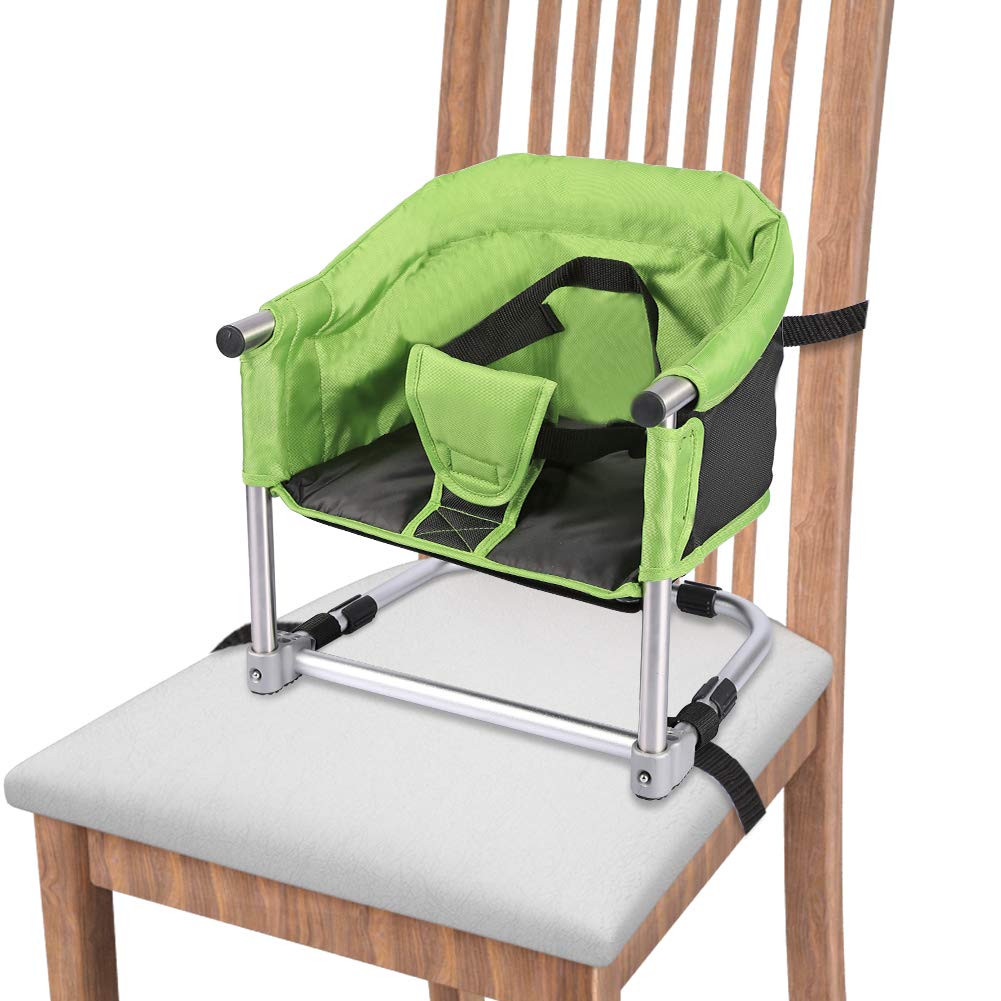 Toogel booster seat folded at the dining table for compact travel use.