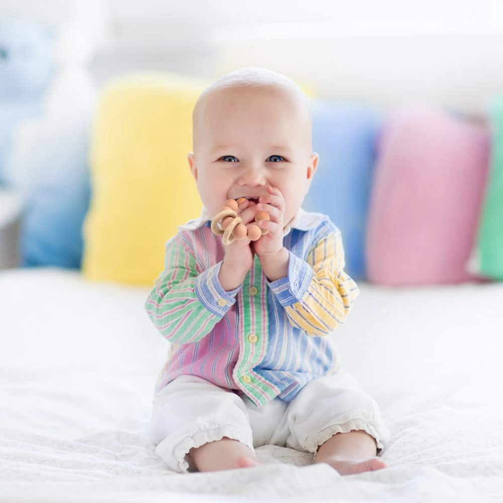 TopGomes baby teether demonstrates right grip size for easy grasp.