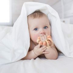 TopGOMES baby teether with beech wood handle, durable and safe.