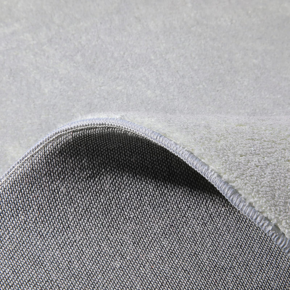 Topotdor round rug ships folded with crease-care instructions.