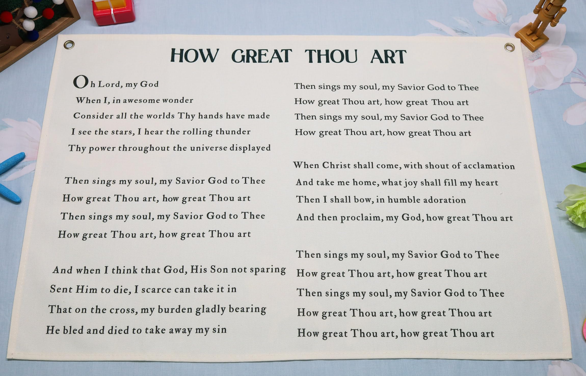Topthink Christian Hymn banner hangs above crib to create nursery focal point.