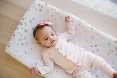 TotAha changing pad cover closeup shows plush fabric texture and hypoallergenic feel.