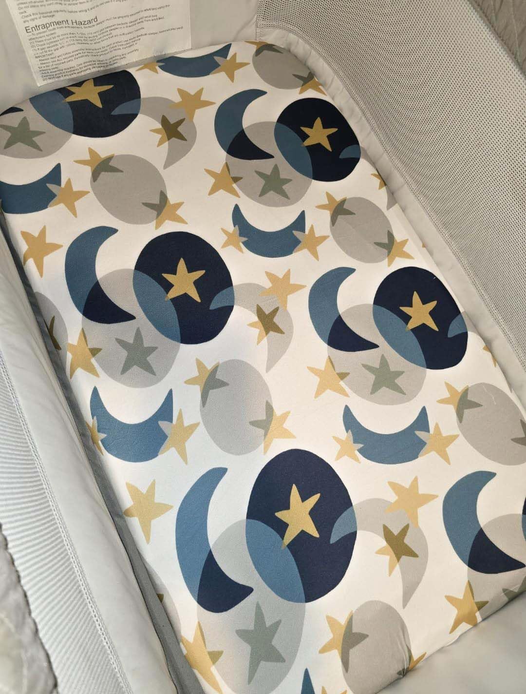 TotAha Space mini crib sheets fit snugly on playard mattress for Graco compatibility.