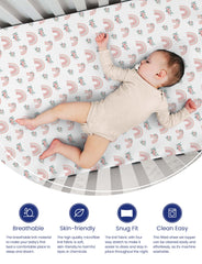 TotAha rainbow two-pack sheets shown on a mini crib for practical size