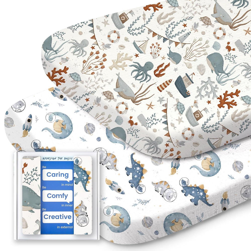 TotBASIC bassinet sheet with dino and whale pattern for gentle, cozy sleep in compatible bassinets.