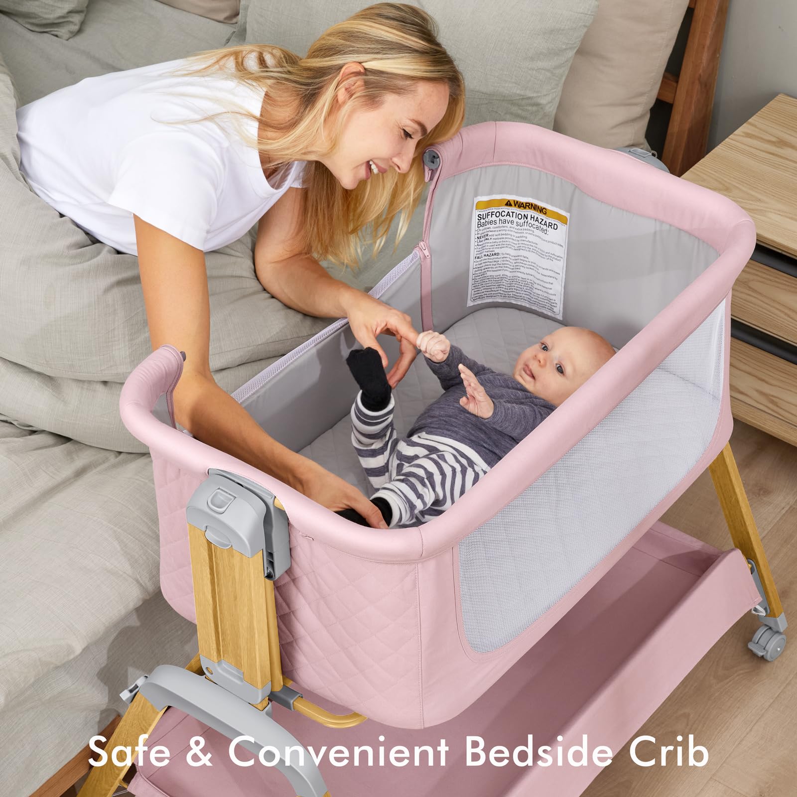 TotRun Bassinet bedside sleeper pink bed-attachment demonstrates secure night feeds.
