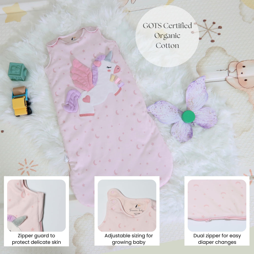 Toucan Baby Unicorn sleep sack shows two-way zip for easy diaper changes.