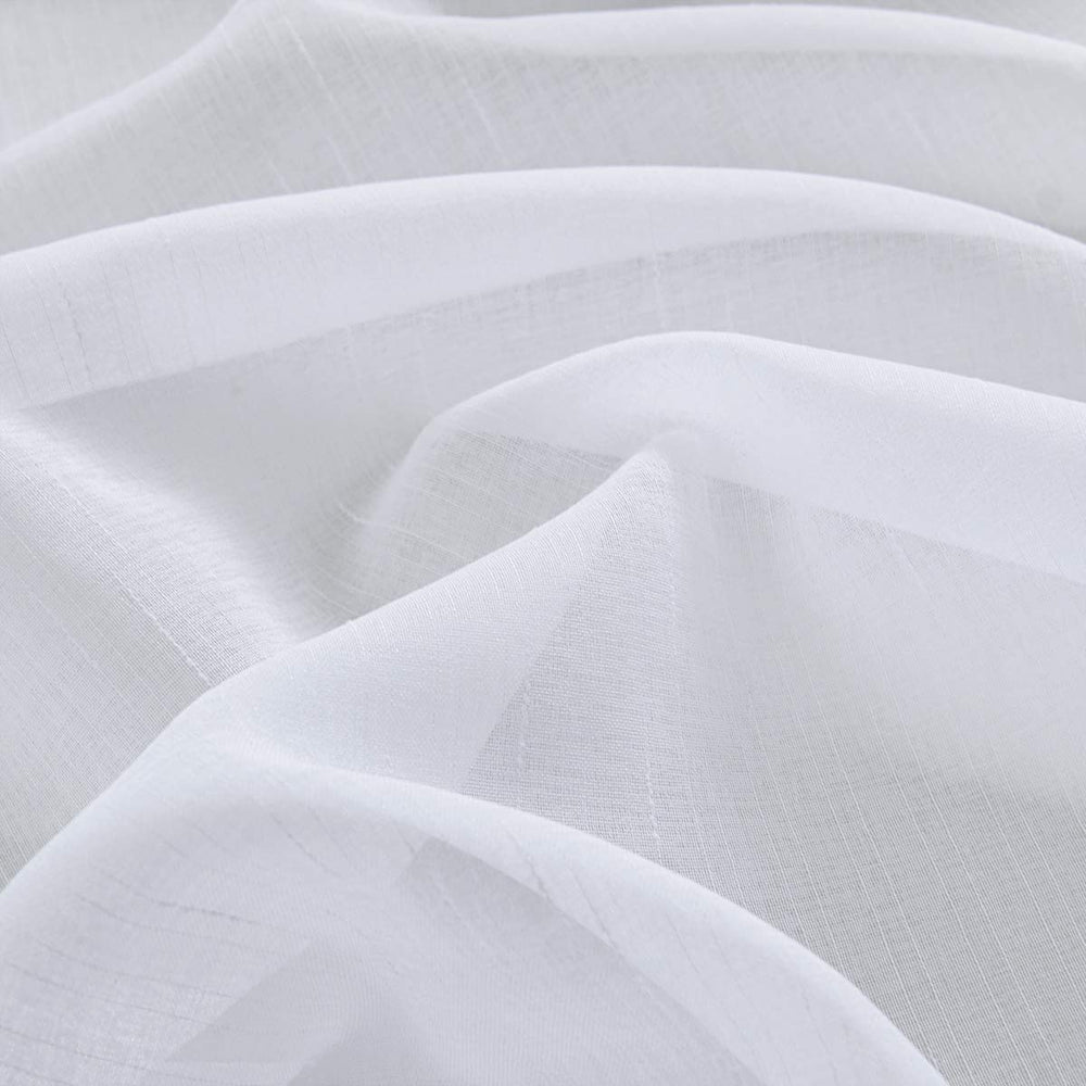 Treatmentex pom pom border detail adds modern charm to living spaces.