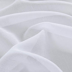Treatmentex pom pom border detail adds modern charm to living spaces.