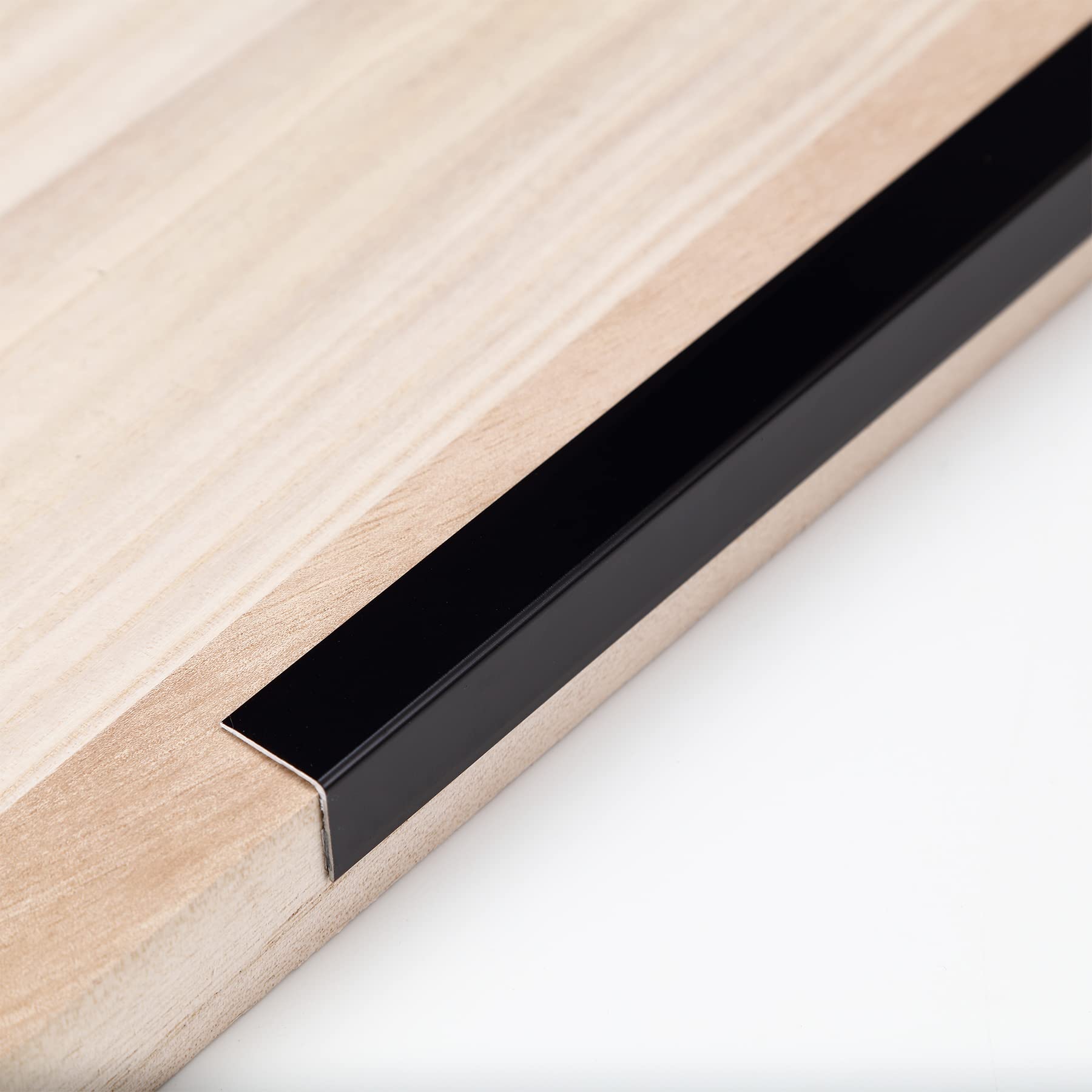 Trimold aluminum peel-and-stick L-molding corner guard at 90°, protects wall corners from everyday bumps.