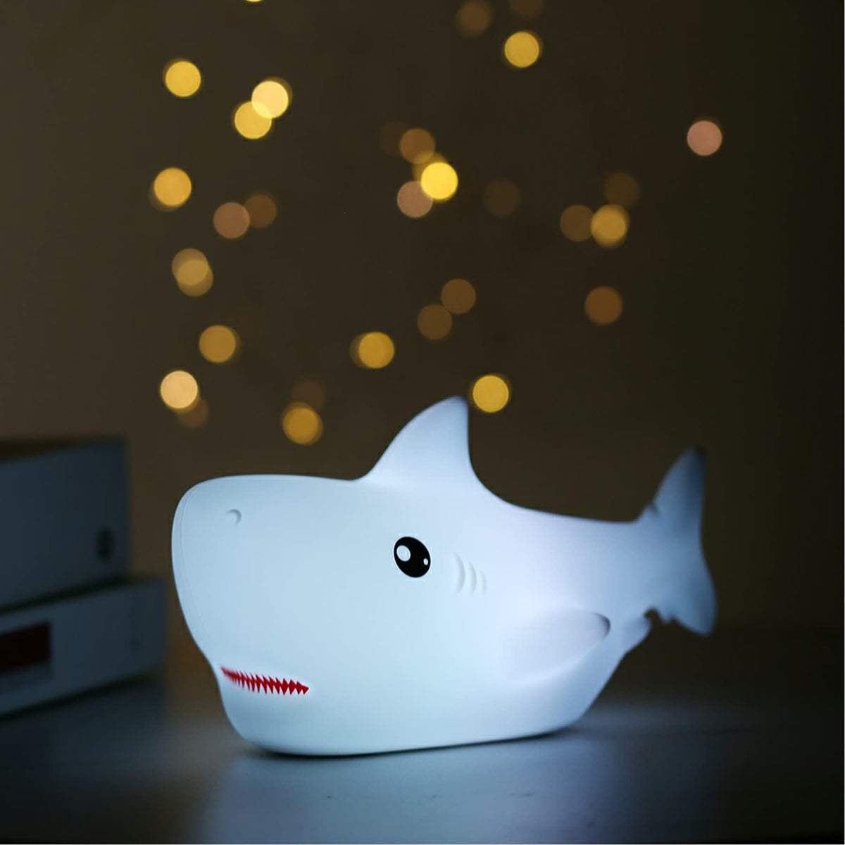 TriPro shark silicone nursery night light close-up with a soft, kid-friendly glow.
