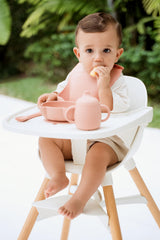 Trompo adjustable silicone bib catches drips and keeps clothes dry.