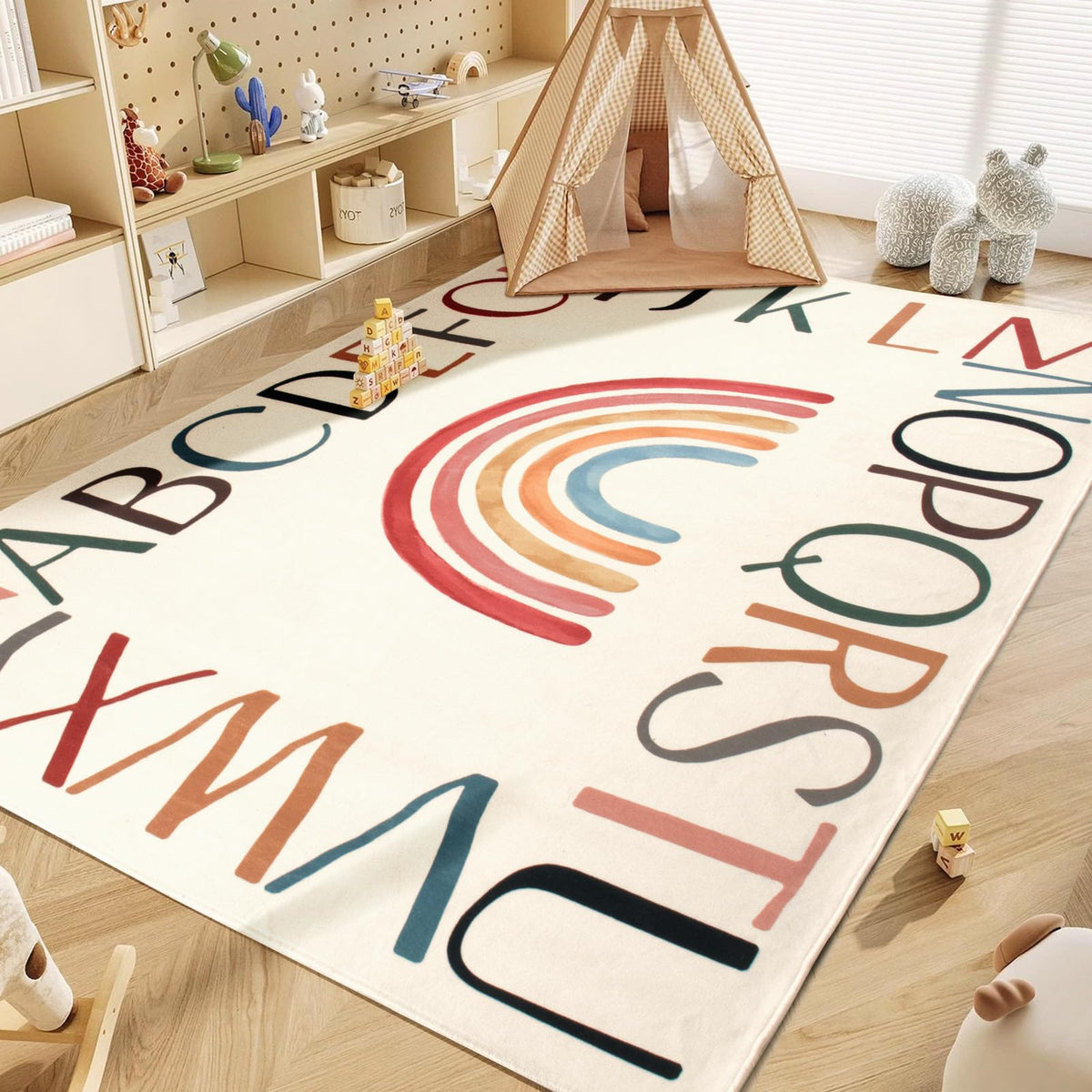 Truqual round rainbow nursery rug highlights the soft surface ideal for crawling and play.
