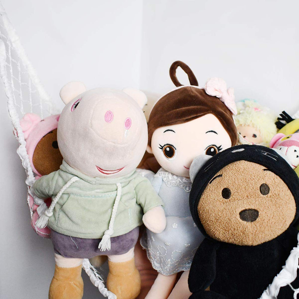 TTSAM white hammock mesh blends with decor while storing dolls and blankets.