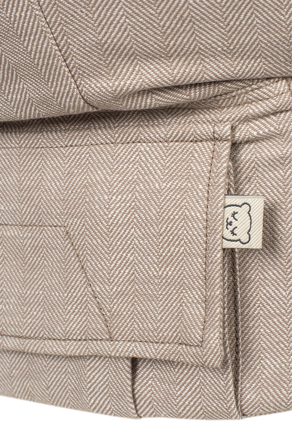 Tula Linen Toddler Carrier Sand — back view showing secure fit and weight distribution