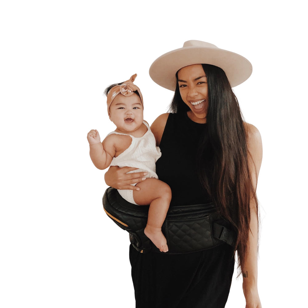 TushBaby bottle holder neatly tucks away for discreet feeding on the go