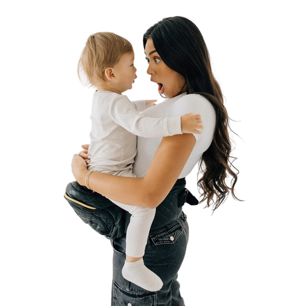 TushBaby hip seat carrier showing ergonomic design for back support