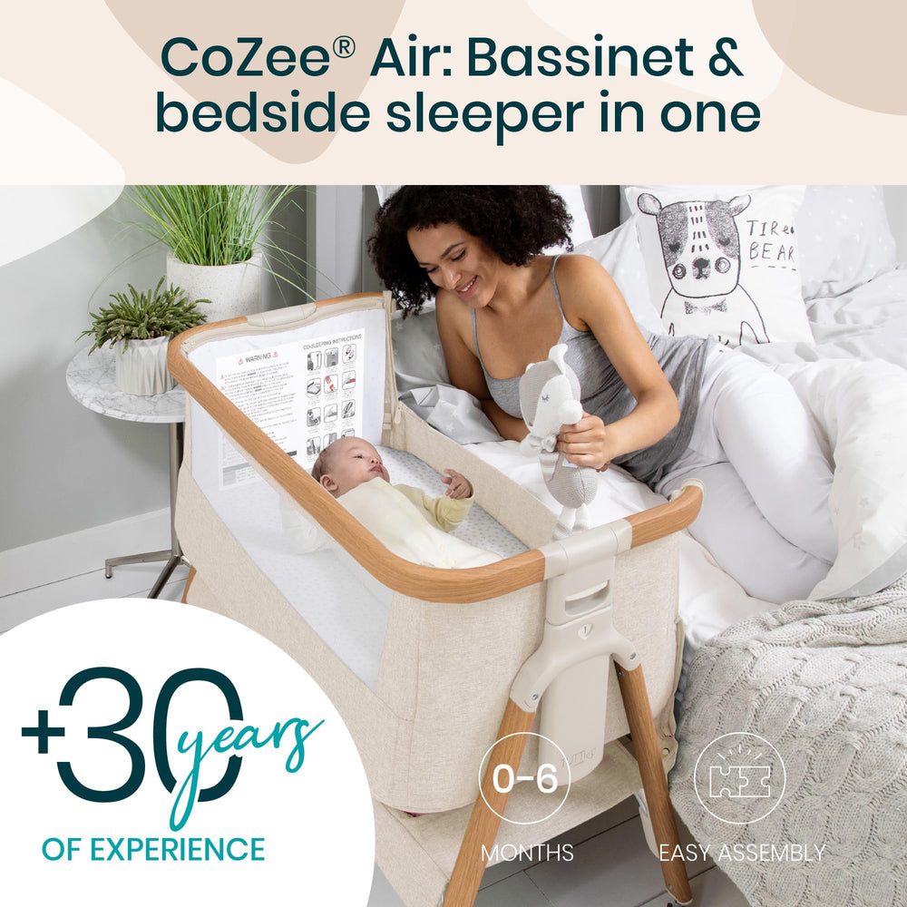 Tutti Bambini CoZee Air bassinet attached to bed for easy nighttime access.