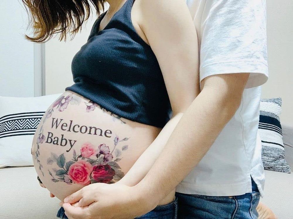 Tuzuru belly sticker applied for quick, mess-free maternity photo setup
