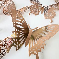 TVPHLLY rose gold butterfly wall decal kit adds shimmering 3D charm to nursery decor.