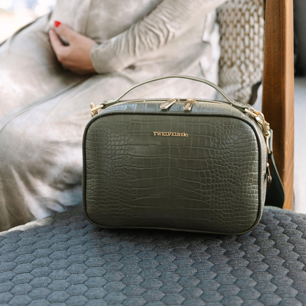 TWELVElittle Luxe Diaper Clutch Wipes Case keeps essentials at hand.