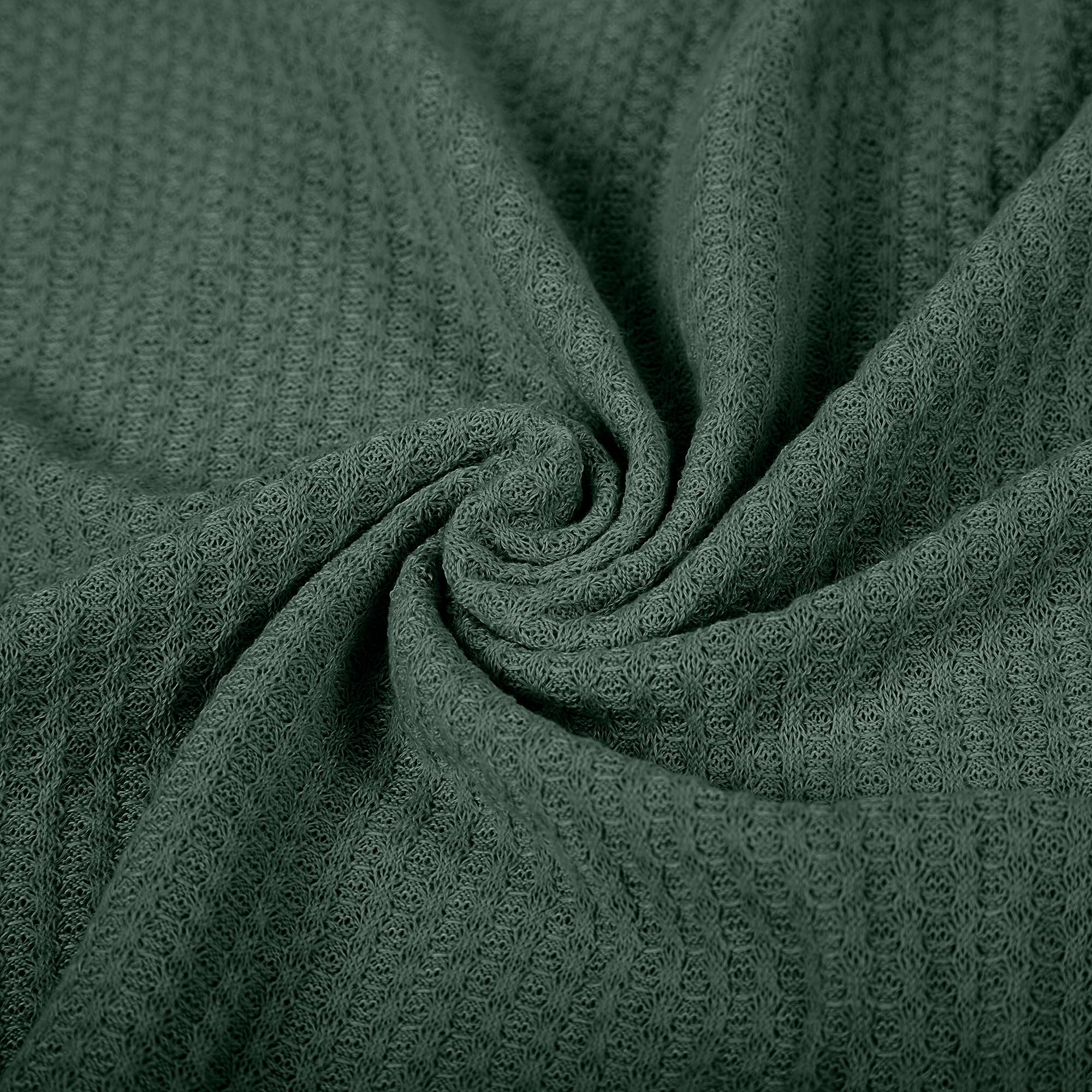 Twinkle Nest dark green wrap in a photography setup with gentle lighting