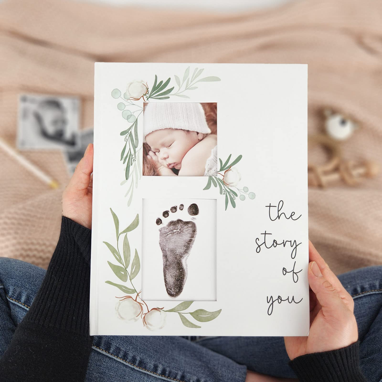 Two Little Dinos lifestyle shot showing a cozy nursery with the memory book.