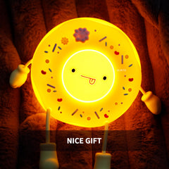 ULIKTO Cute Donut Lamp on table providing soft night light for kids.