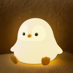 UNEEDE Sitting Penguin Night Light with silicone touch for cozy bedtime glow.