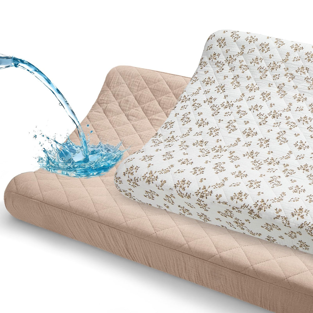 Unicorn Castle changing pad cover with muslin top layer, soft and absorbent for gentle diaper changes.
