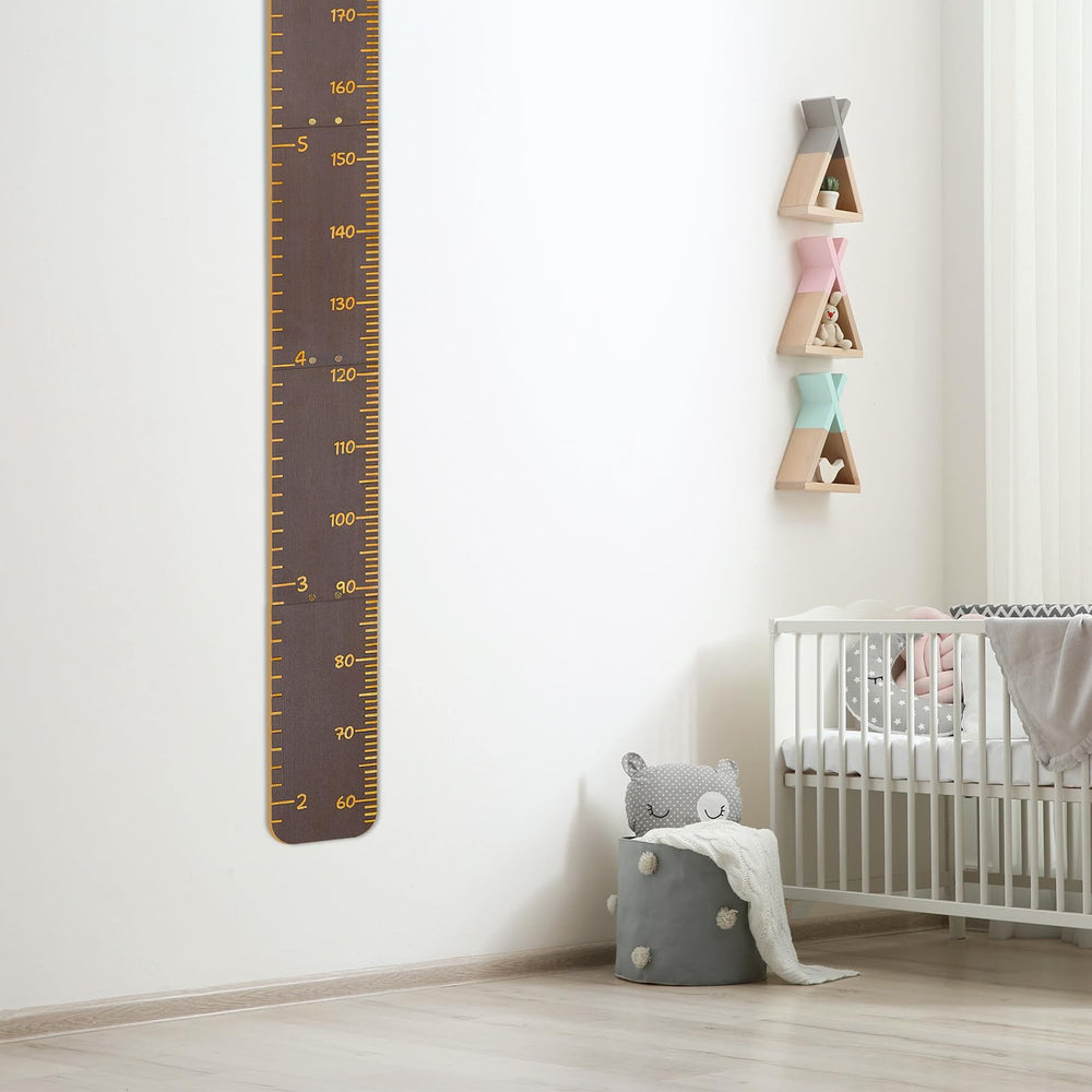 Nursery decor enhances kid's room with Unicorn Castle height chart on wall