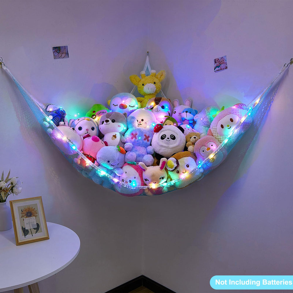 Blue Unicorn Castle toy storage hammock neatly tucks plush toys in corners.