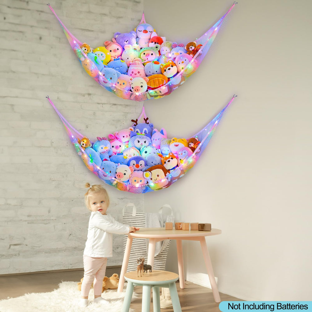 Unicorn Castle toy storage hammock in a nursery corner helping keep plush toys organized