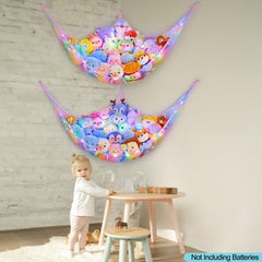 Unicorn Castle toy storage hammock in a nursery corner helping keep plush toys organized
