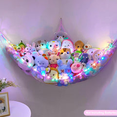 Unicorn Castle toy storage net keeps plush toys off the floor.