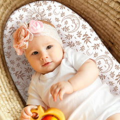 Universal-fit design secures rectangle, round, oval, and hourglass bassinet shapes.