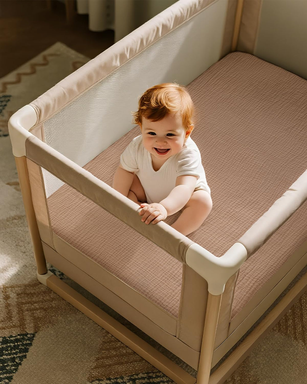 Unnivoll muslin sheets in beige and brown to match nursery decor.