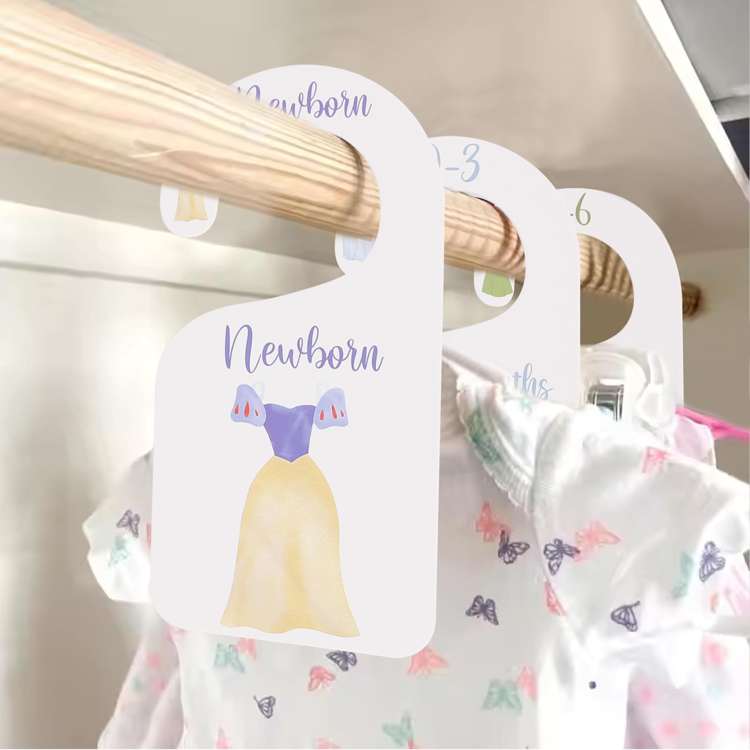 UOAOU Princess closet divider on a hanger organizes newborn outfits.