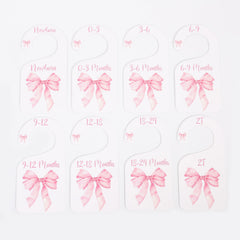 UOAOU bow-nursery-closet-divider-pink adds soft color to nursery décor and organization.